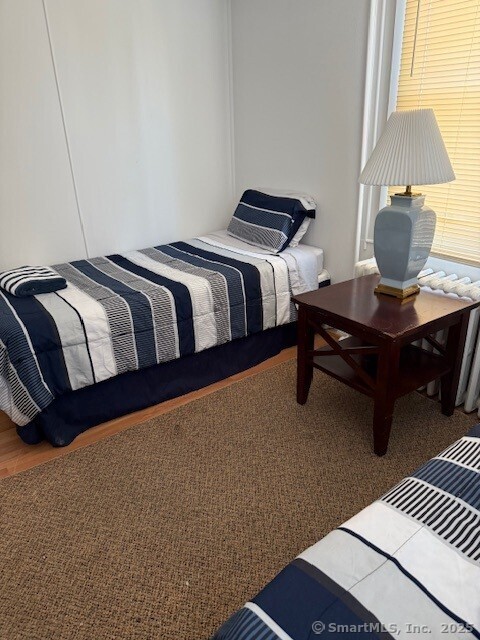 2144 Fairfield Beach Road Fairfield, CT 06824 - Photo 16 of 32 a bedroom with a bed and a lamp