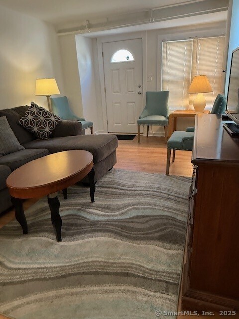 2144 Fairfield Beach Road Fairfield, CT 06824 - Photo 5 of 32 a living room with furniture and a table