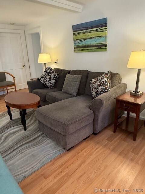 2144 Fairfield Beach Road Fairfield, CT 06824 - Photo 6 of 32 a living room with couches and a table