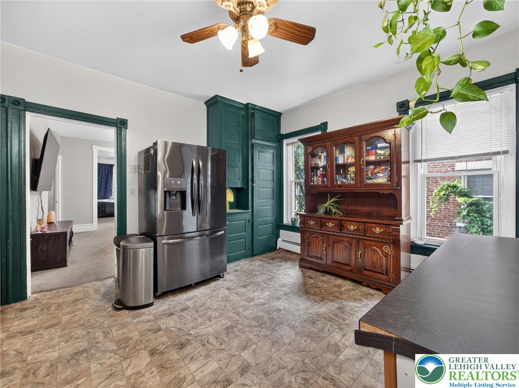 425 Ridge Street Emmaus, PA 18049 - Photo 13 of 27 A vibrant kitchen space showcases a stainless steel refrigerator and ample cabinet storage.