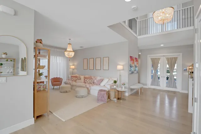 a open dining room with stainless steel appliances kitchen island granite countertop a table and chairs in it