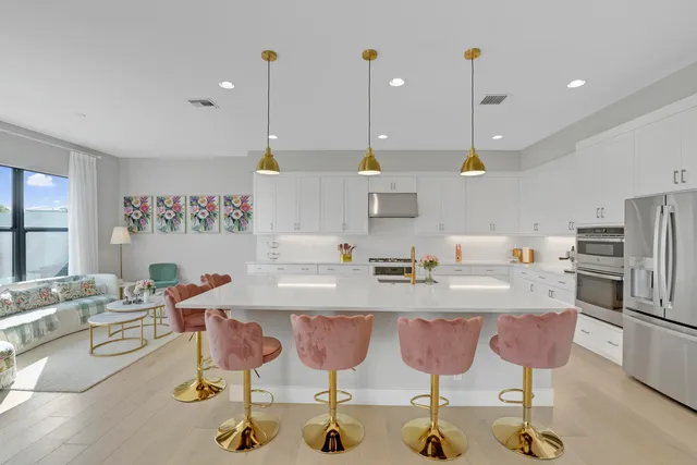 a bedroom with a bed and chandelier