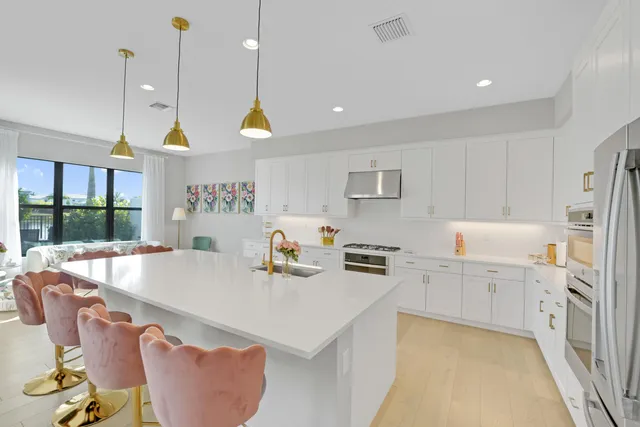 a bedroom with a bed and large windows