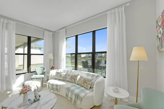 a view of a balcony with lake view and wooden floor