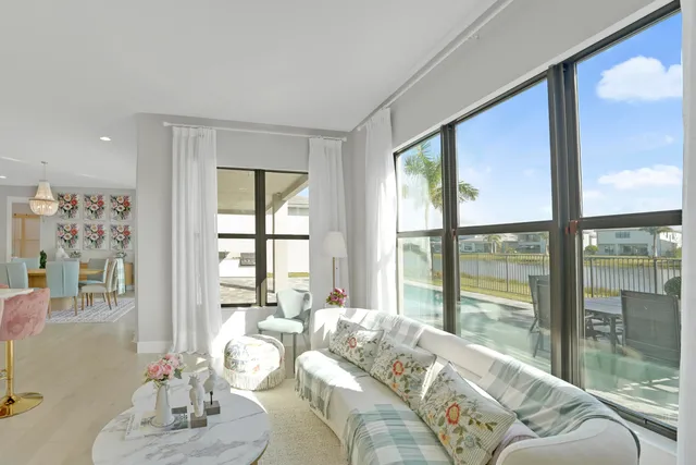 a view of a house with backyard and sitting area