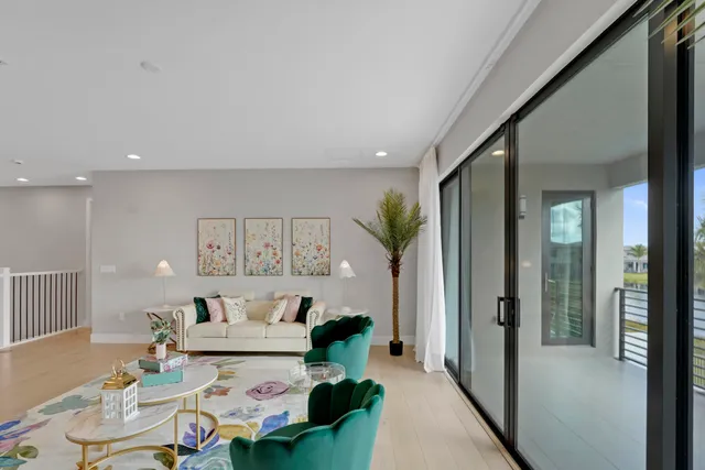 a view of swimming pool with outdoor seating and city view