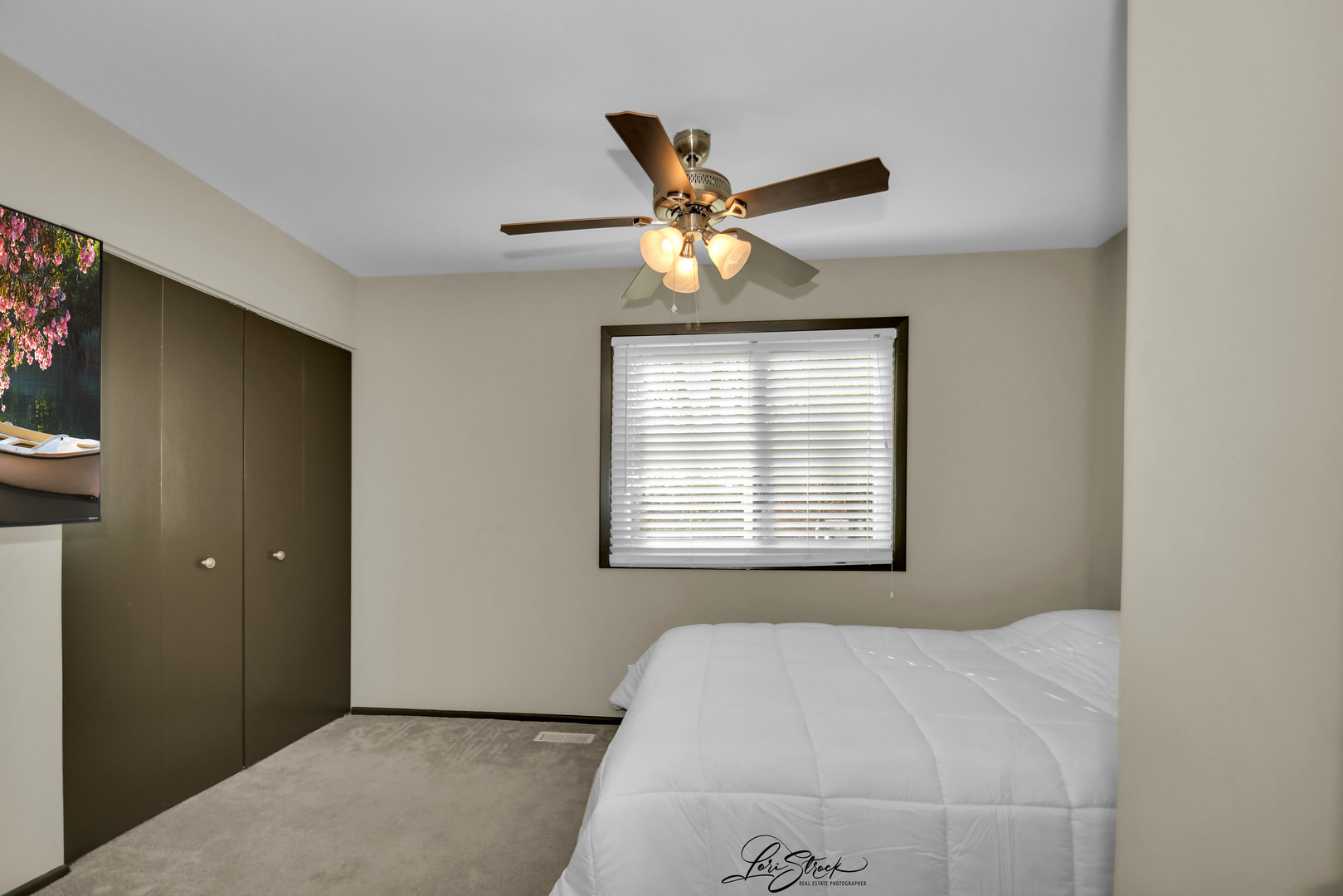 1052 Florimond Drive Elgin, IL 60123 - Photo 13 of 24 a bedroom with a bed and a chandelier