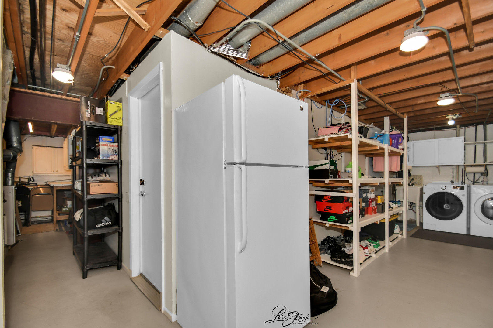 1052 Florimond Drive Elgin, IL 60123 - Photo 17 of 24 a view of walk in closet with clothes and shoes
