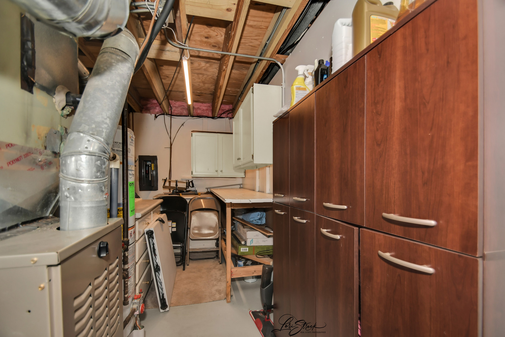 1052 Florimond Drive Elgin, IL 60123 - Photo 18 of 24 a view of walk in closet with clothes and shoes