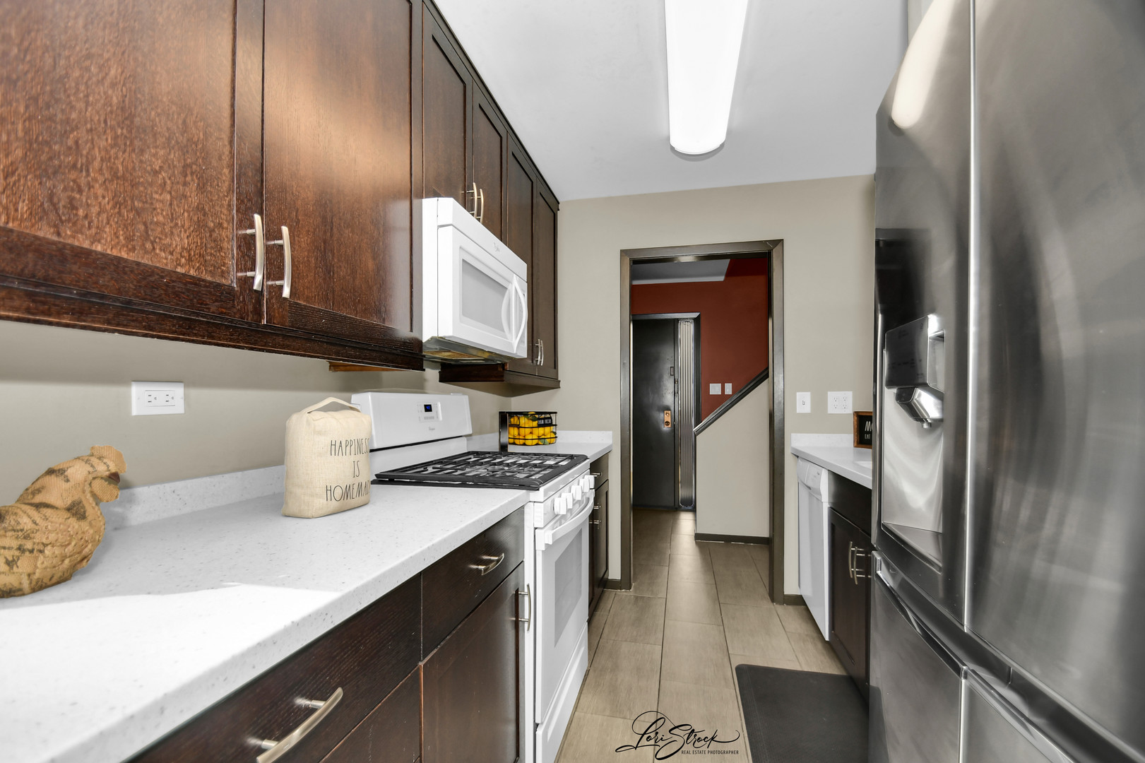 1052 Florimond Drive Elgin, IL 60123 - Photo 8 of 24 a kitchen with stainless steel appliances a sink stove and refrigerator