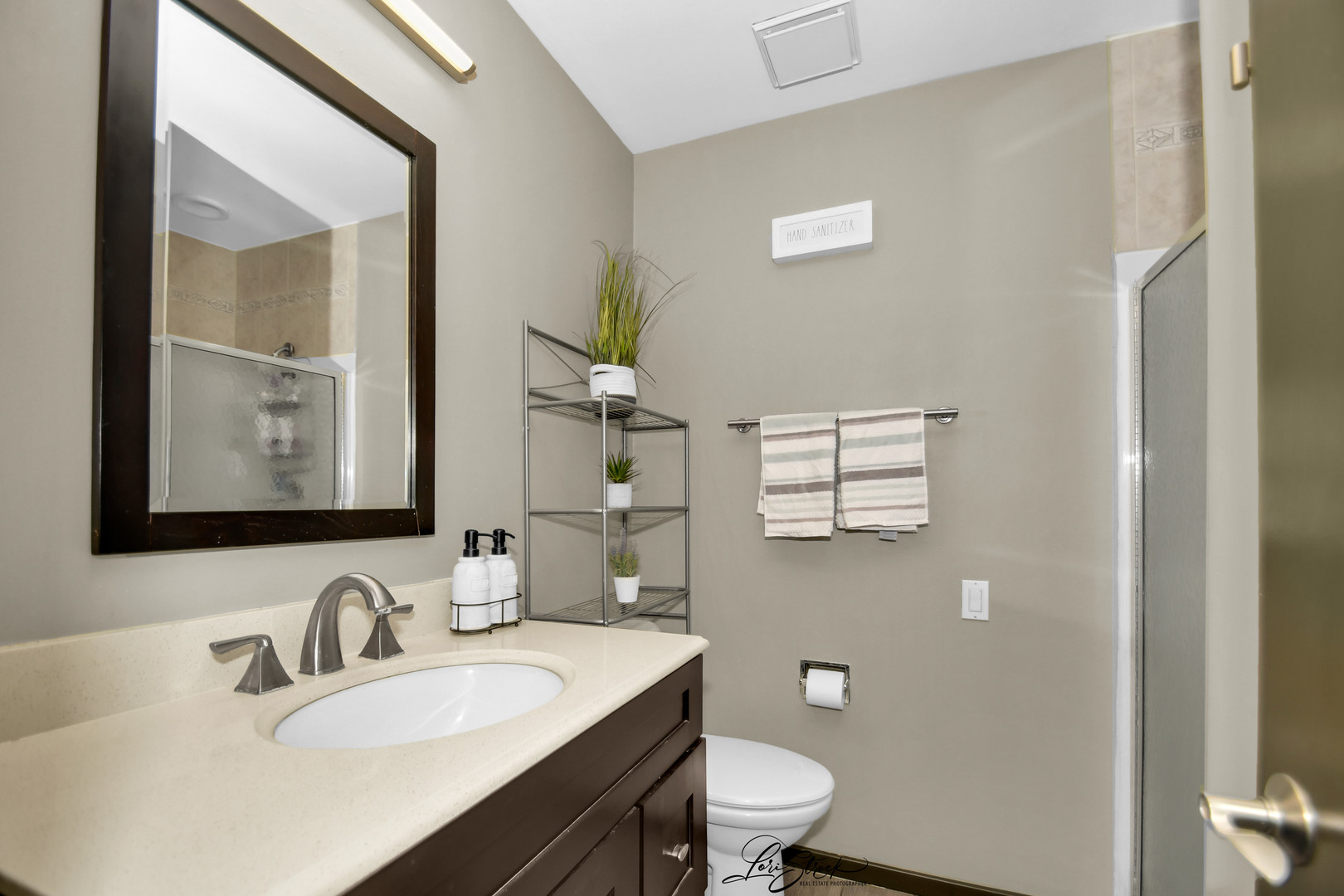 1052 Florimond Drive Elgin, IL 60123 - Photo 9 of 24 a bathroom with a granite countertop sink toilet and mirror