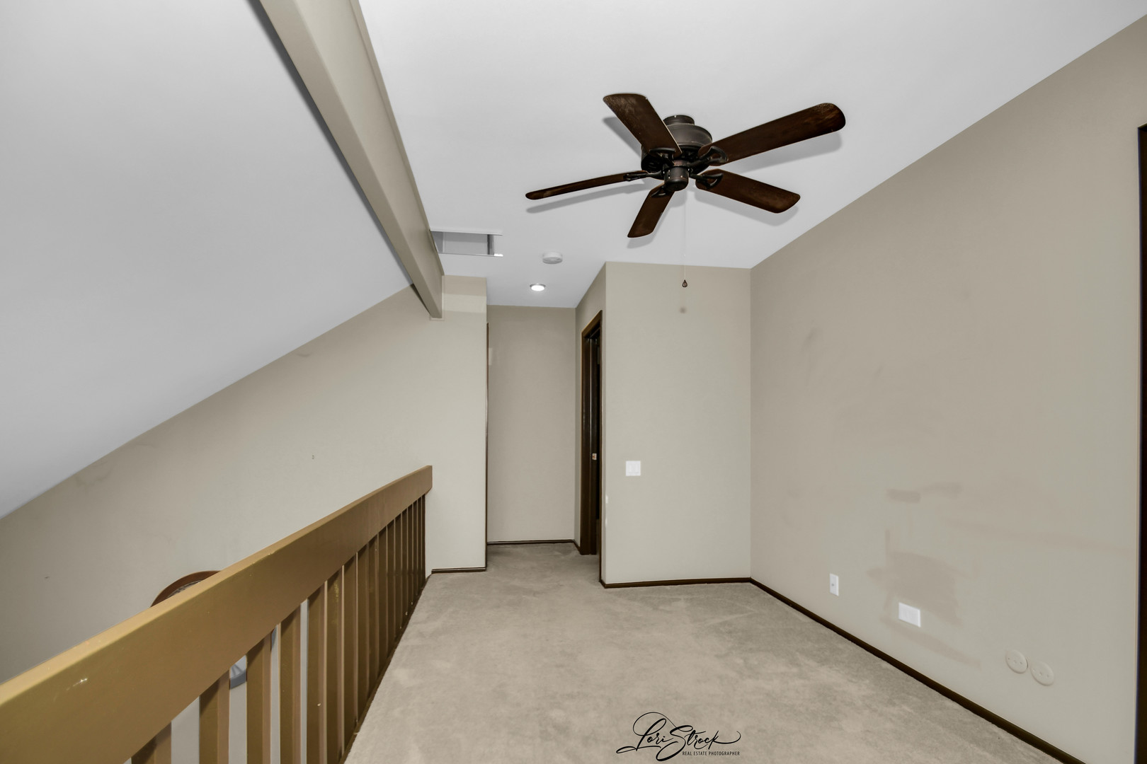 1052 Florimond Drive Elgin, IL 60123 - Photo 10 of 24 a view of a hallway with a ceiling fan