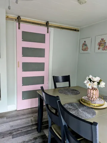 a view of a workspace with furniture