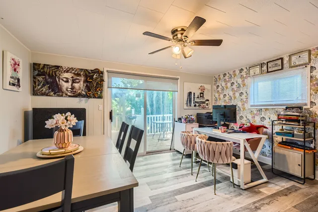 a view of a dining room with furniture window and outside view