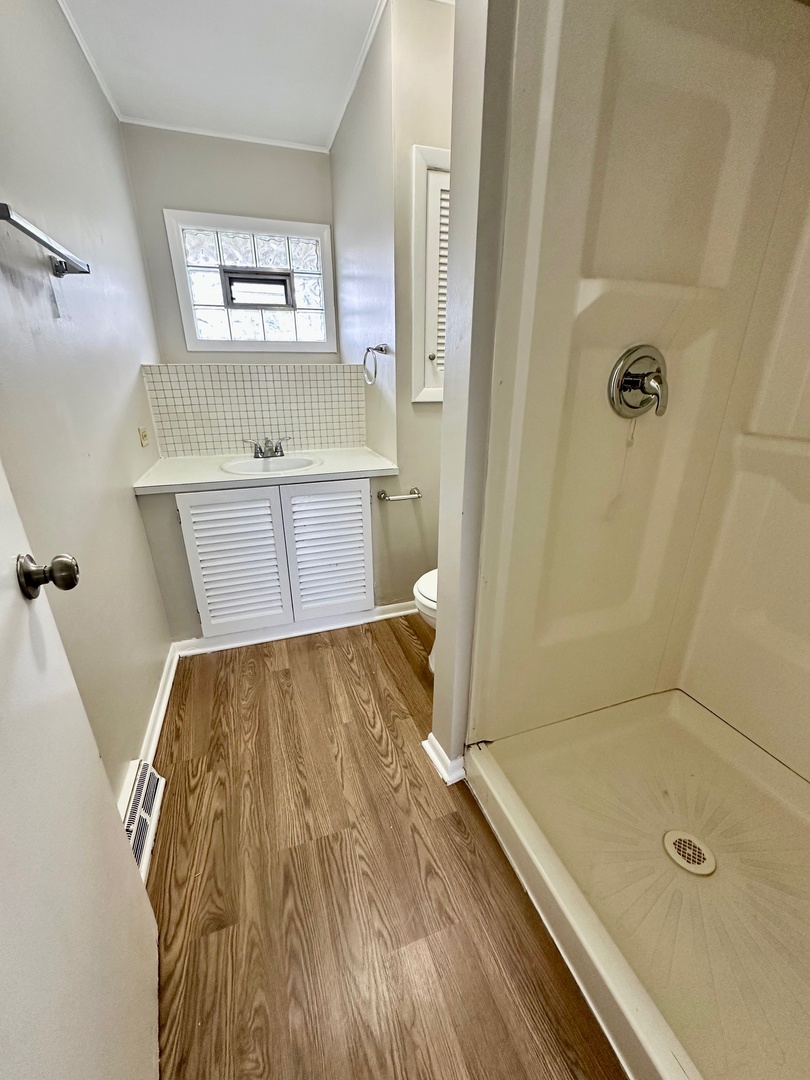 3729 Grove Avenue Berwyn, IL 60402 - Photo 12 of 20 a bathroom with a tub sink and shower