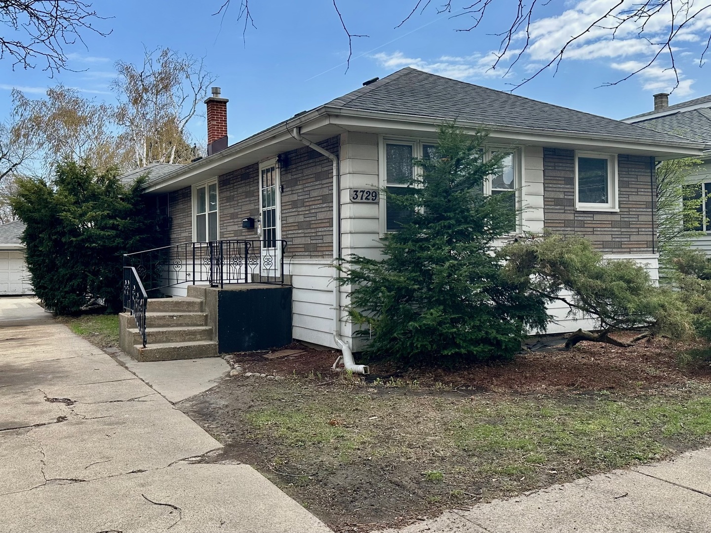 3729 Grove Avenue Berwyn, IL 60402 - Photo 20 of 20 a front view of a house with a garden