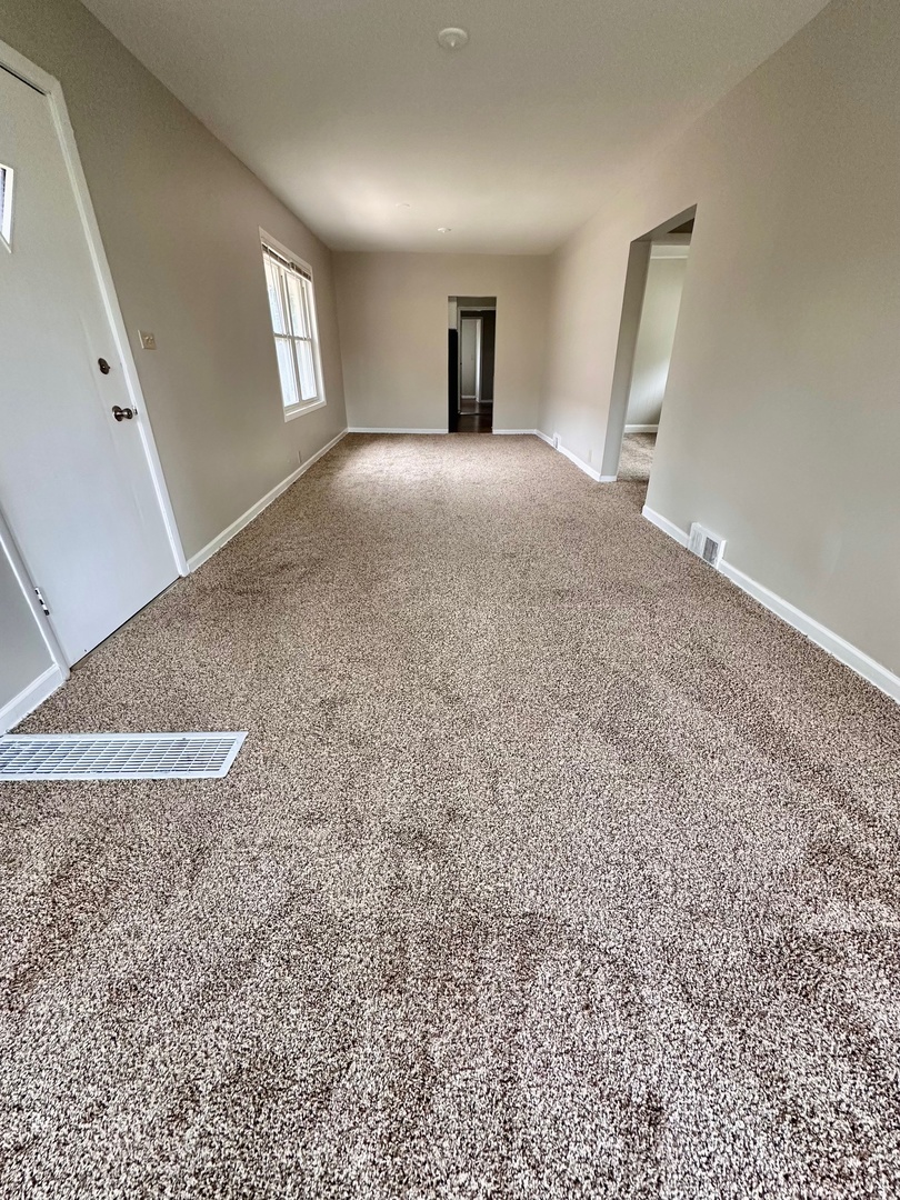 3729 Grove Avenue Berwyn, IL 60402 - Photo 3 of 20 a view of empty room with window