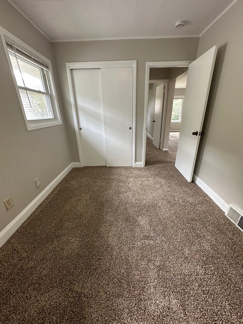 3729 Grove Avenue Berwyn, IL 60402 - Photo 6 of 20 an empty room with windows