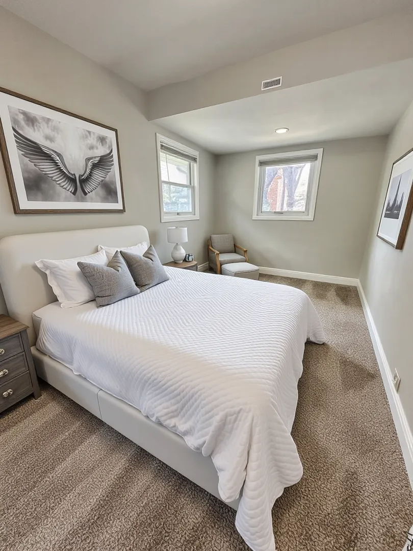 3729 Grove Avenue Berwyn, IL 60402 - Photo 7 of 20 a bedroom with a bed and a painting on the wall