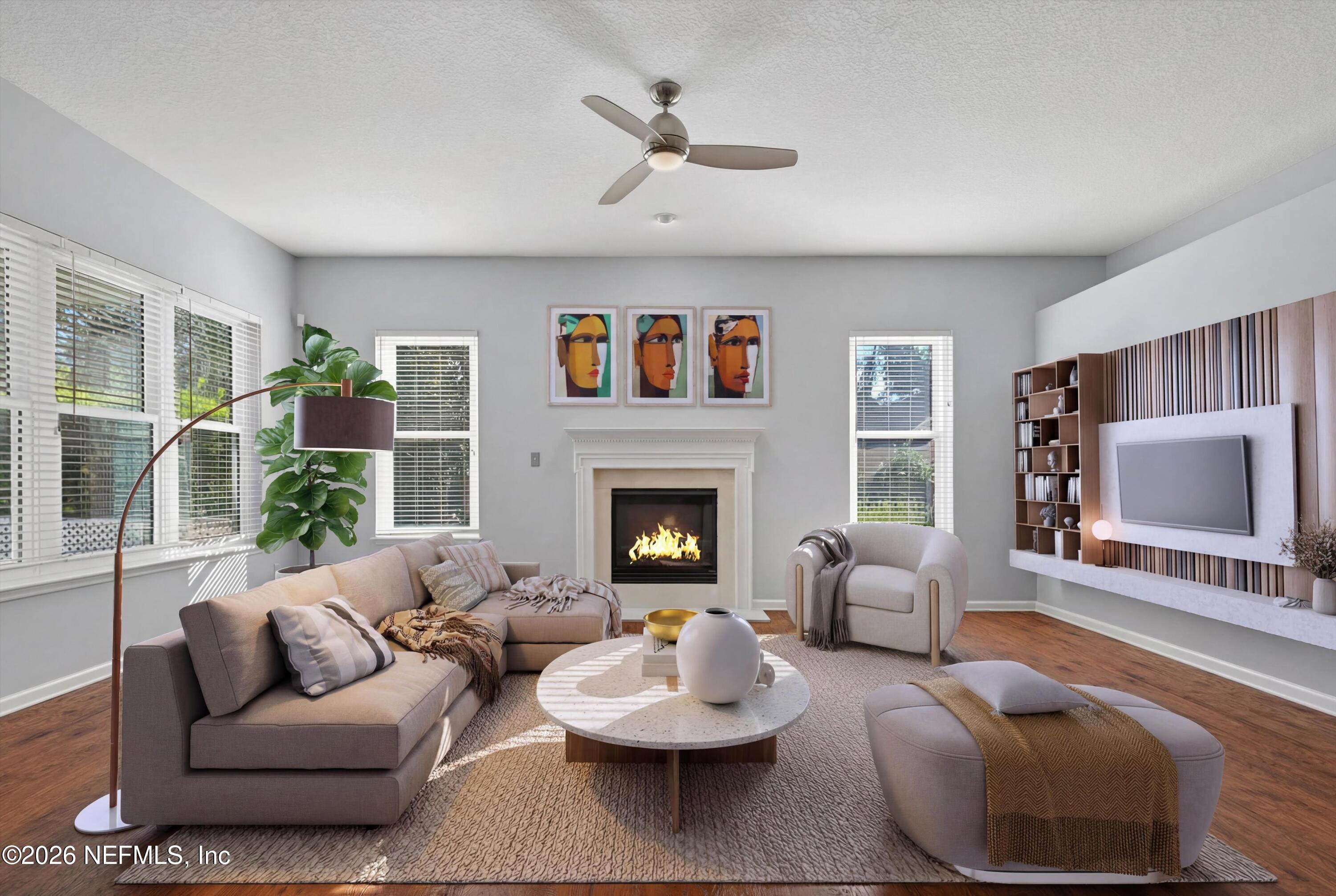 237 Strawberry Lane St. Johns, FL 32259 - Photo 11 of 28 a living room with furniture and a fireplace