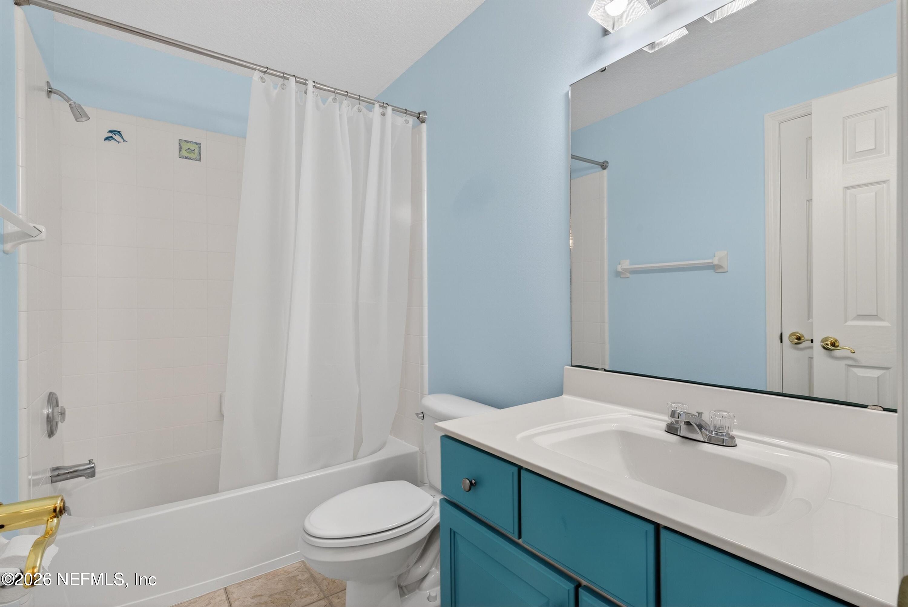 237 Strawberry Lane St. Johns, FL 32259 - Photo 18 of 28 a bathroom with a sink a toilet and a mirror