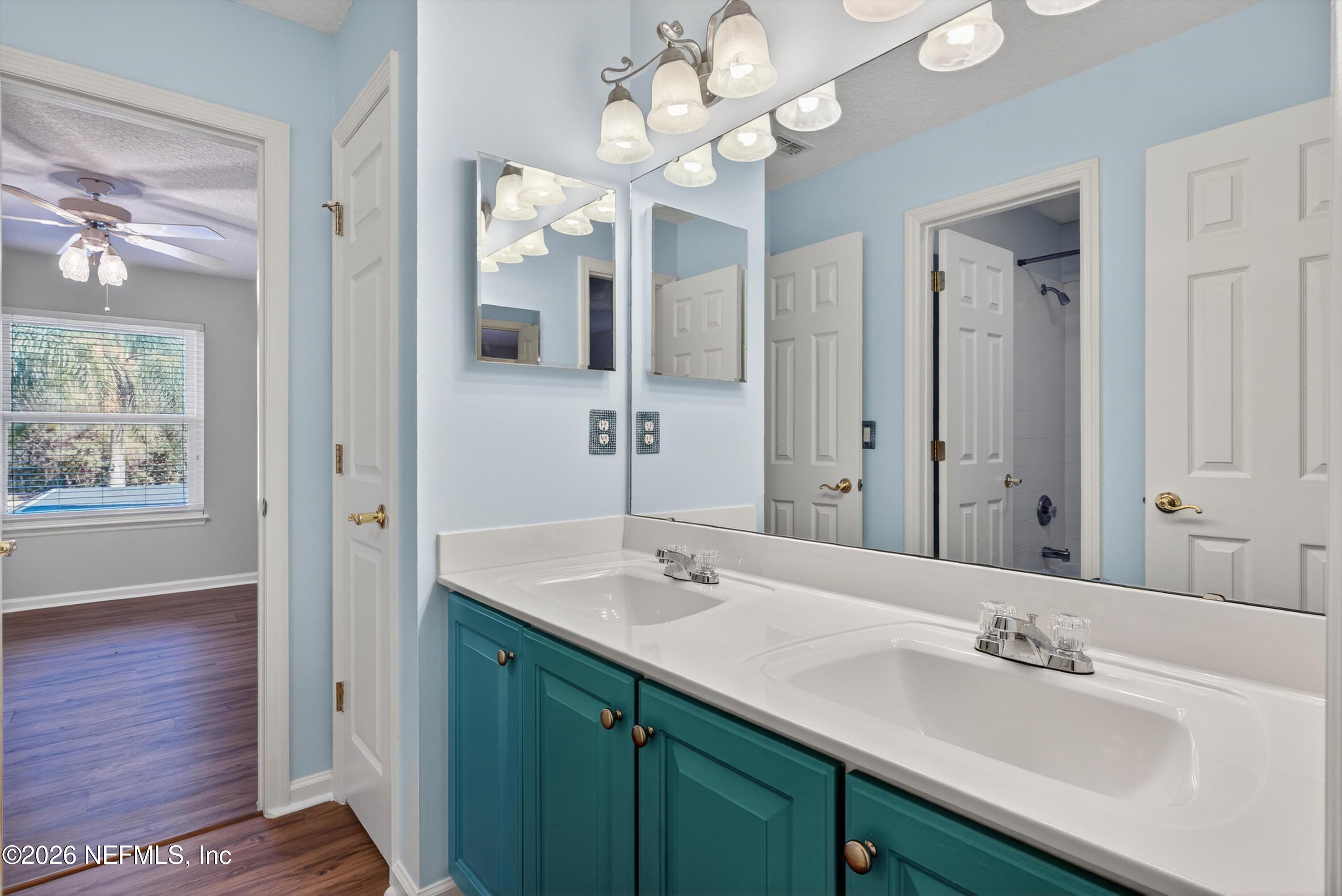 237 Strawberry Lane St. Johns, FL 32259 - Photo 20 of 28 a bathroom with a sink vanity and a mirror