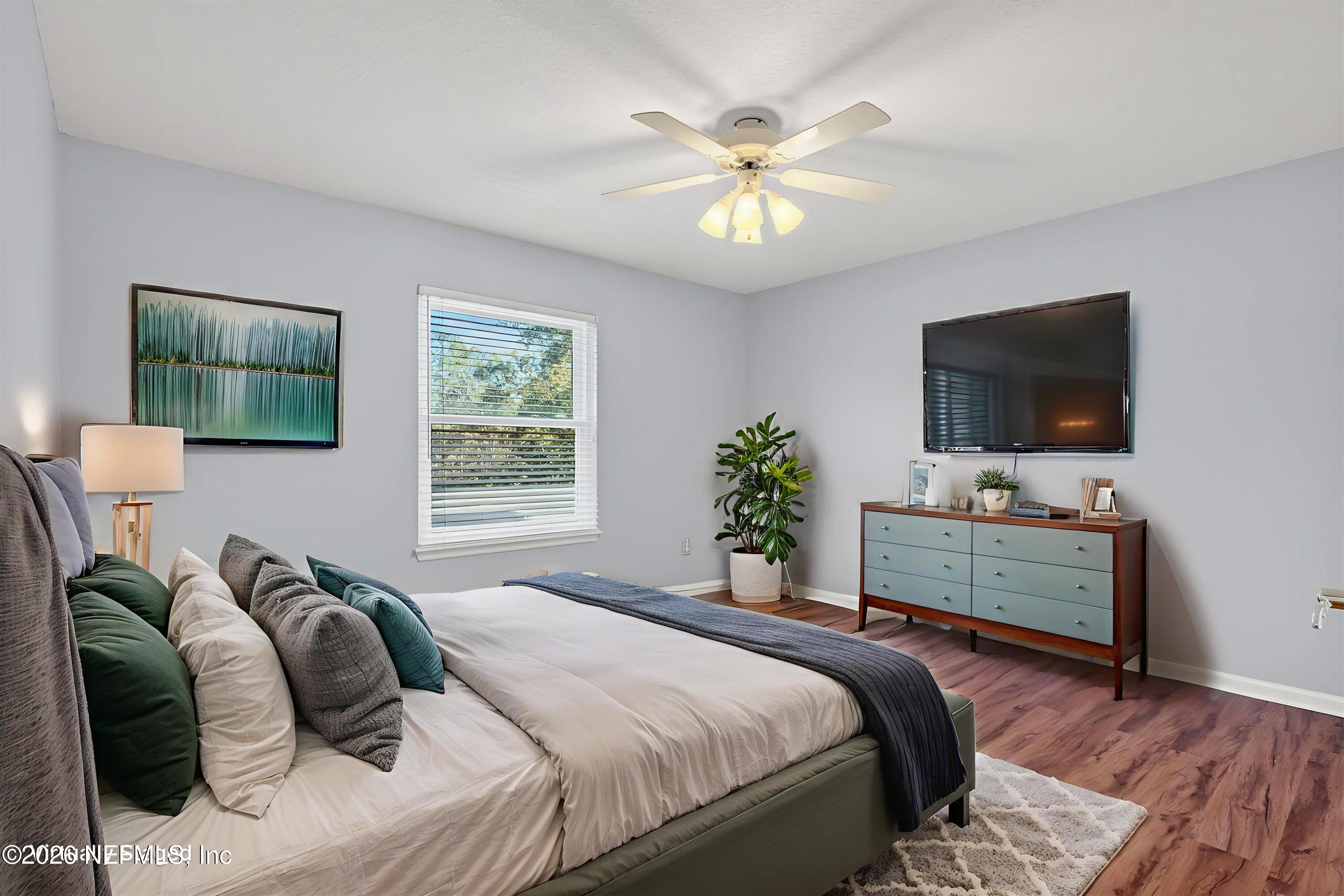 237 Strawberry Lane St. Johns, FL 32259 - Photo 22 of 28 a bedroom with a bed and a flat screen tv