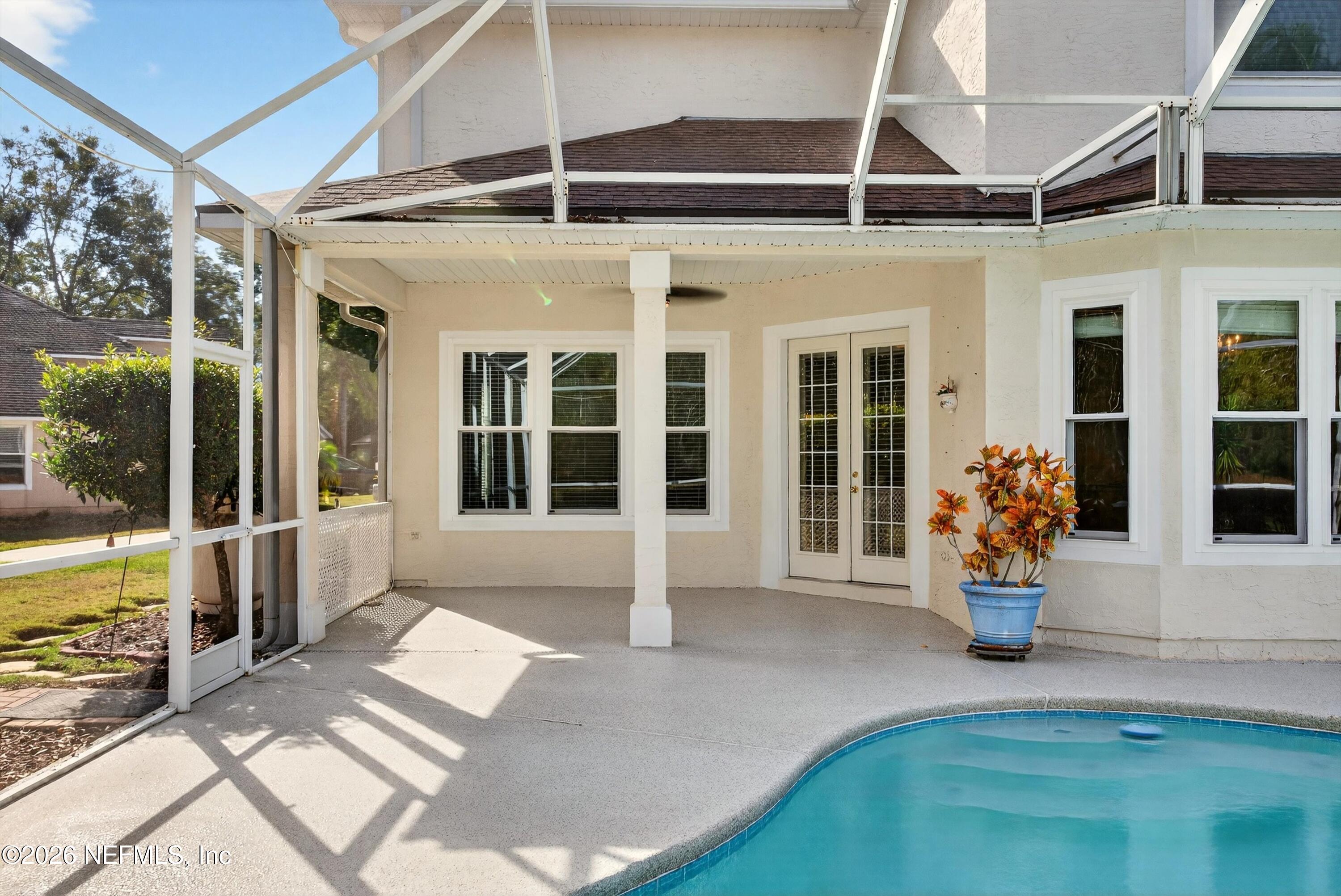 237 Strawberry Lane St. Johns, FL 32259 - Photo 23 of 28 a view of a balcony with chair and a potted plant