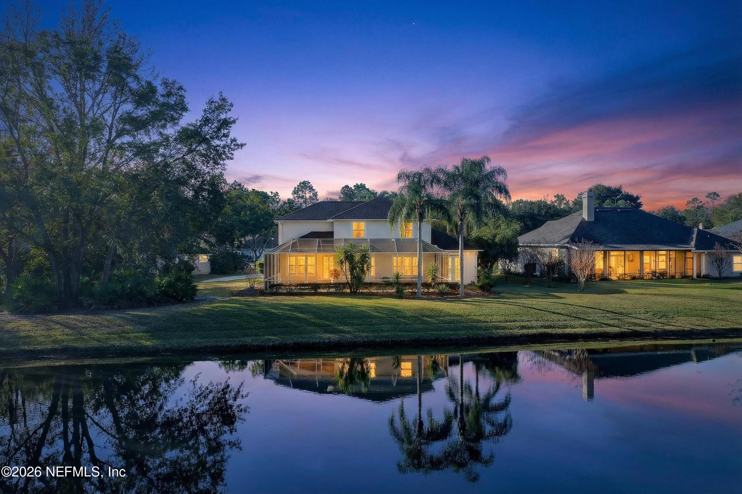 237 Strawberry Lane St. Johns, FL 32259 - Photo 3 of 28 a view of a lake with a house in the background