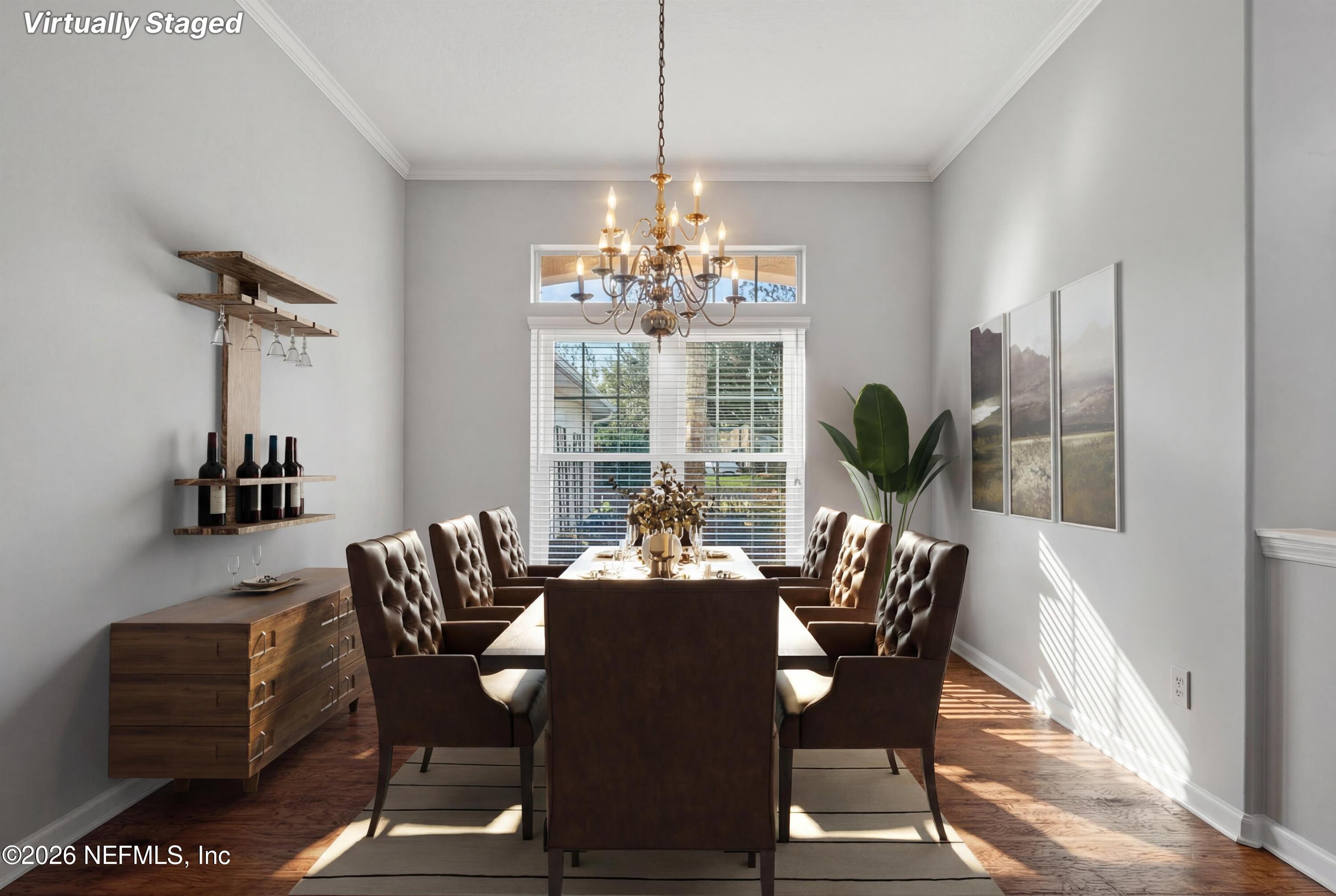 237 Strawberry Lane St. Johns, FL 32259 - Photo 10 of 28 a dining room with furniture potted plants and wooden floor