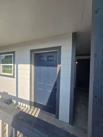 a view of entryway with wooden floor