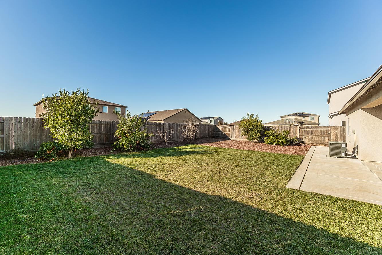 1428 Shoreside Drive Madera, CA 93637 - Photo 21 of 22 a bathroom with a sink and a yard