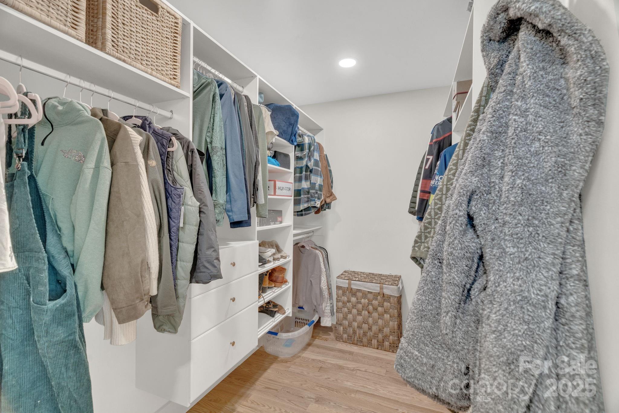30 Spaulding Road Candler, NC 28715 - Photo 13 of 30 a view of walk in closet with clothes and shoes