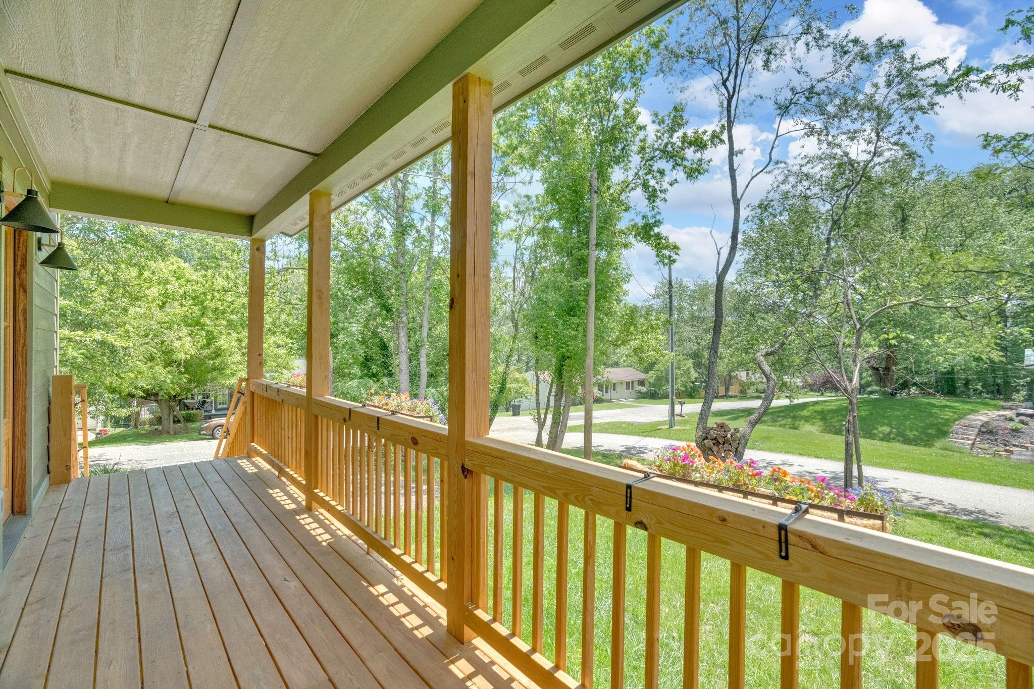 30 Spaulding Road Candler, NC 28715 - Photo 26 of 30 a view of a porch with wooden floor and outdoor space