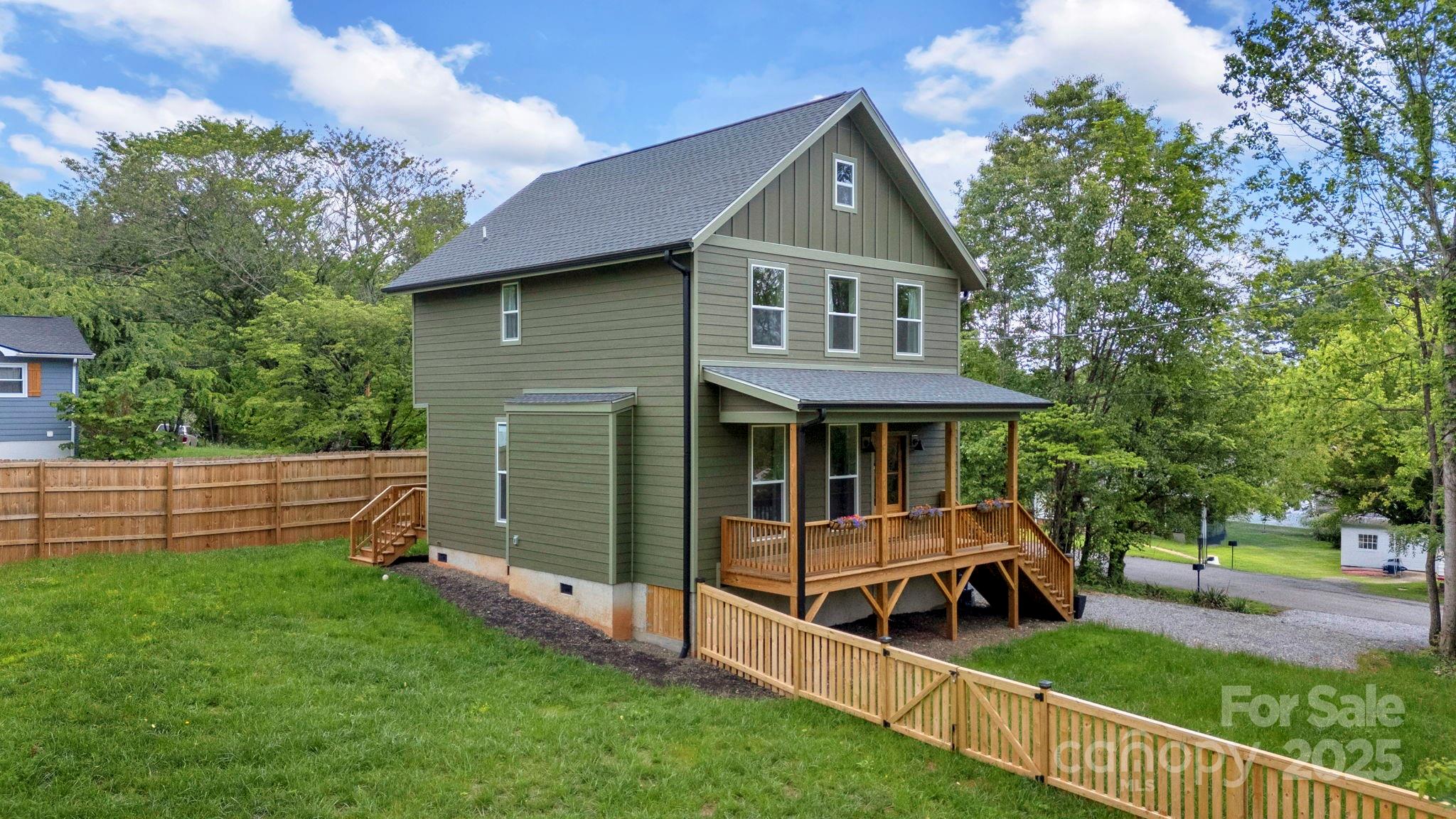 30 Spaulding Road Candler, NC 28715 - Photo 27 of 30 a view of a house with backyard and a tree