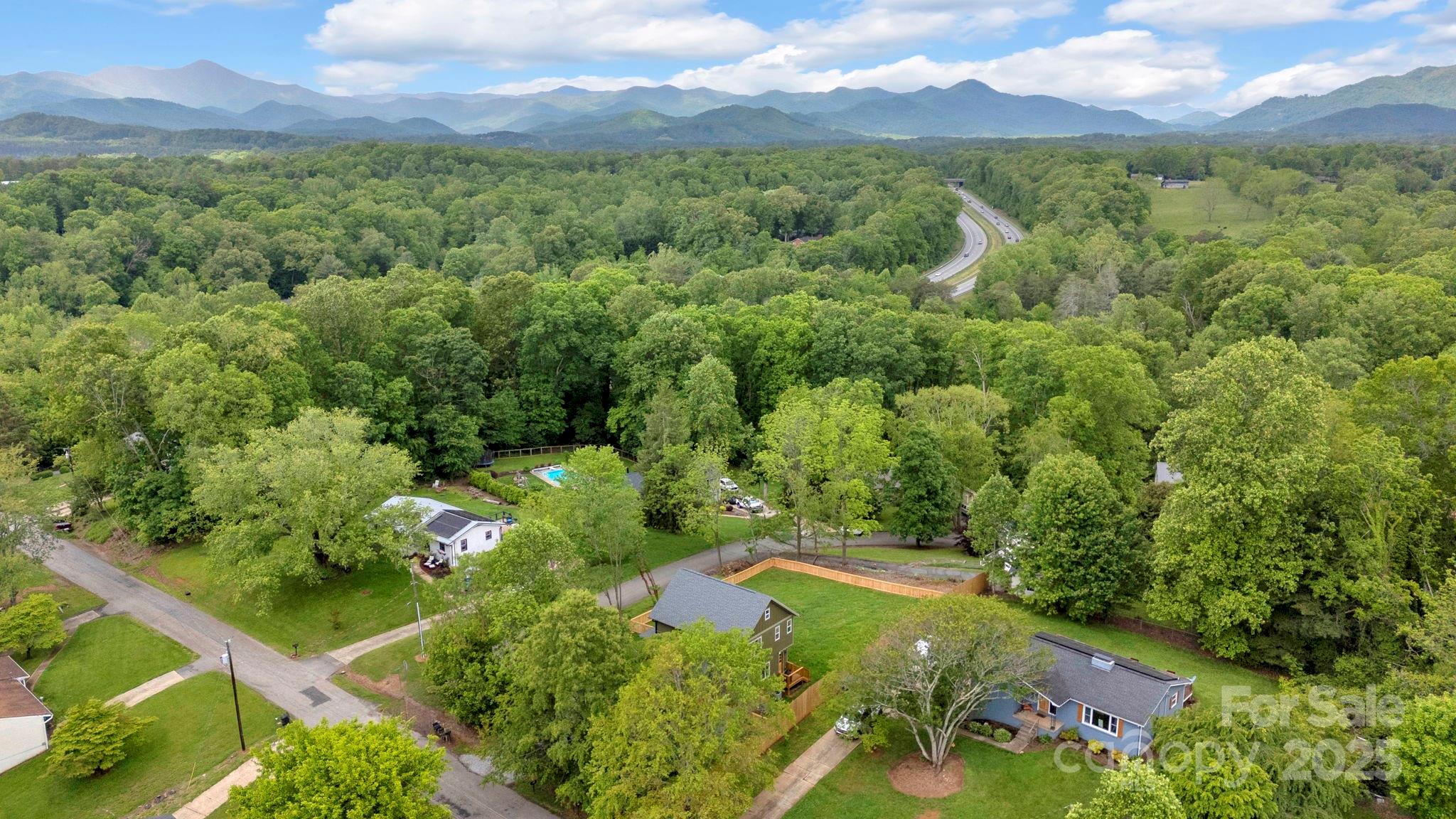 30 Spaulding Road Candler, NC 28715 - Photo 29 of 30 a view of a lush green forest with houses