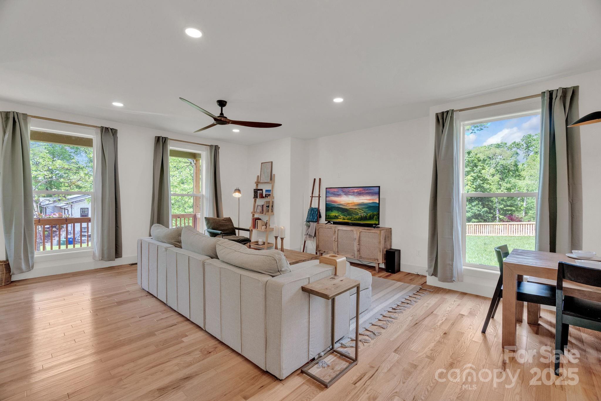 30 Spaulding Road Candler, NC 28715 - Photo 6 of 30 a living room with furniture and a flat screen tv