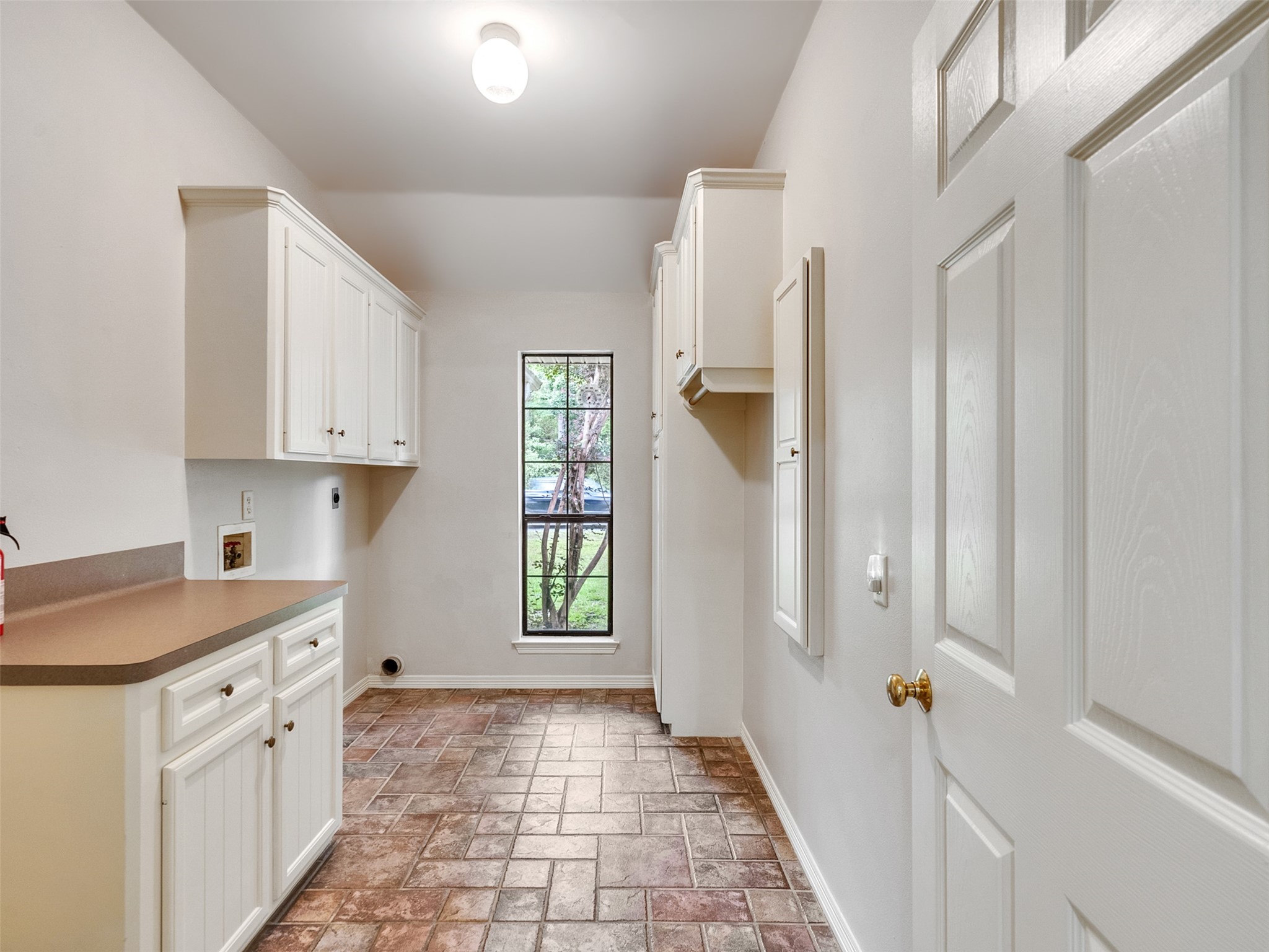 195 Coral Gables Trinity, TX 75862 - Photo 14 of 50 a view of a kitchen with white cabinets