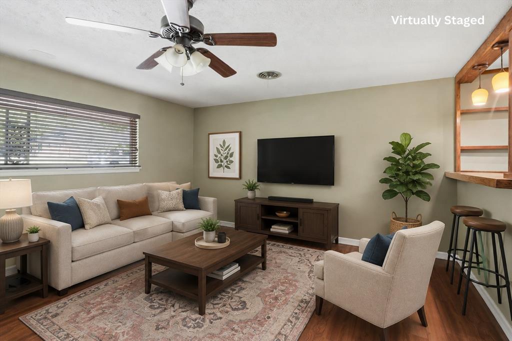 4105 Springbranch Drive Benbrook, TX 76116 - Photo 5 of 30 a living room with furniture and a flat screen tv
