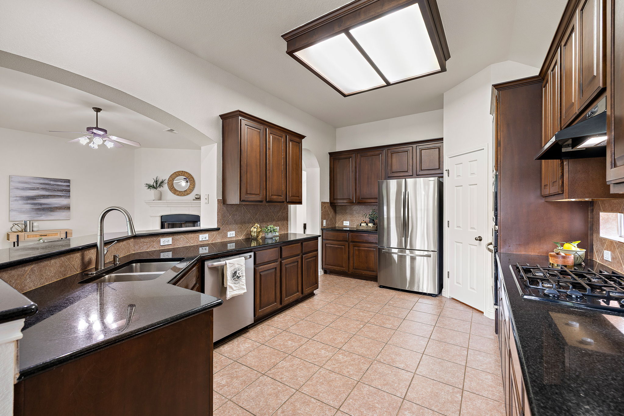1115 Canyon Maple Road Pflugerville, TX 78660 - Photo 12 of 34 Real wood cabinets and granite countertops complete this large kitchen