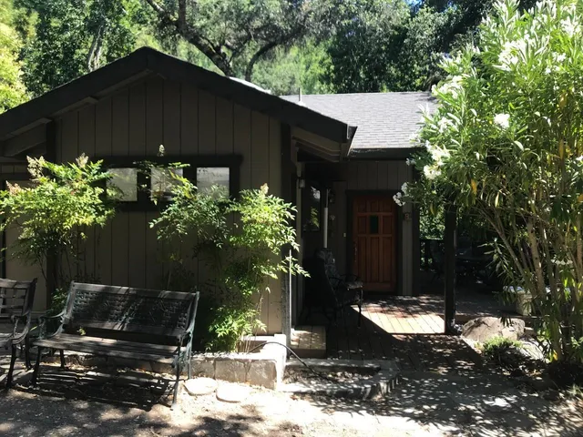 a backyard of a house with lots of green space