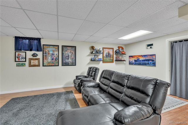 a living room with furniture and a projector