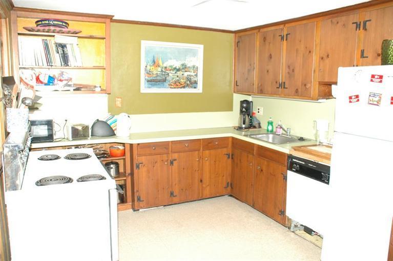 100 Blanid Road Osterville, MA 02655 - Photo 12 of 12 a kitchen with a sink a stove and a refrigerator