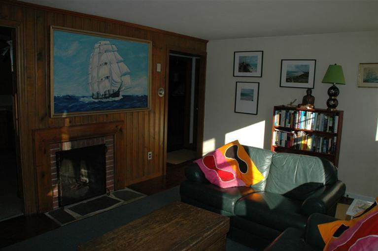 100 Blanid Road Osterville, MA 02655 - Photo 5 of 12 a living room with furniture and a fireplace