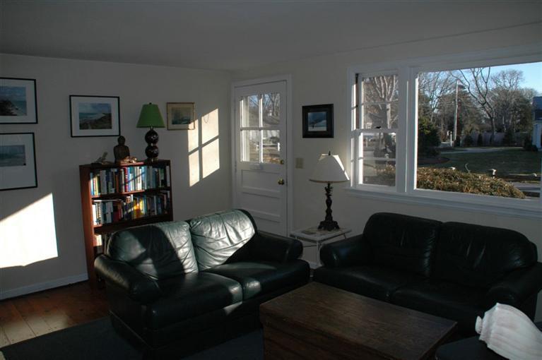 100 Blanid Road Osterville, MA 02655 - Photo 6 of 12 a living room with furniture and a floor to ceiling window