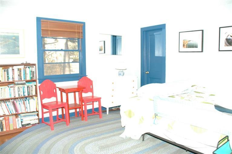 100 Blanid Road Osterville, MA 02655 - Photo 9 of 12 a bedroom with a bed and a window