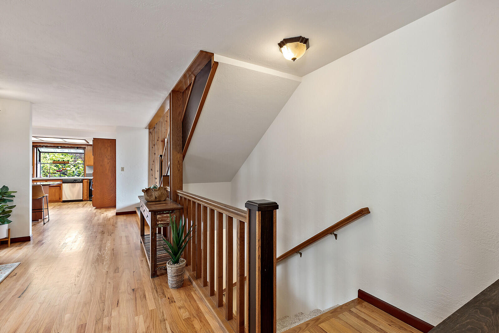 3181 Old Stage Road Central Point, OR 97502 - Photo 37 of 78 a view of a hallway with wooden floor and stairs