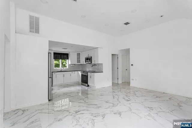 a view of a kitchen with a sink
