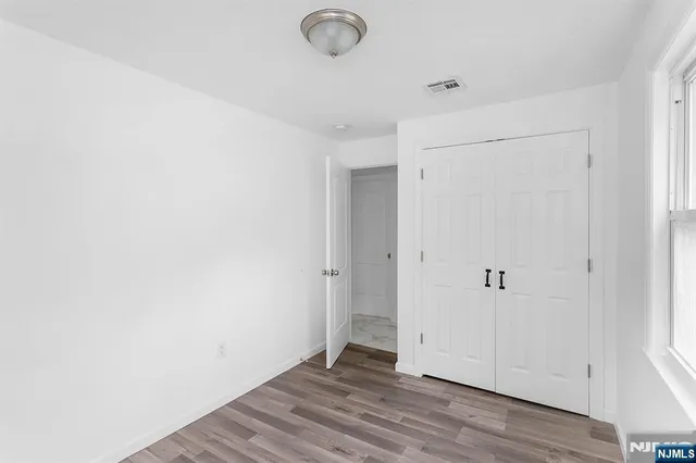 a view of a livingroom with wooden floor