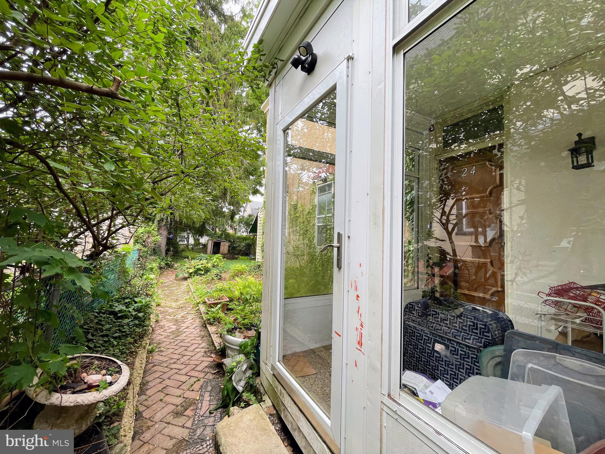 24 Westview Street Philadelphia, PA 19119 - Photo 3 of 13 a view of a balcony with chair and potted plants